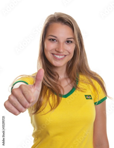 Photo: Smiling brazilian soccer supporter showing thump up Smiling brazilian soccer supporter showing thump up