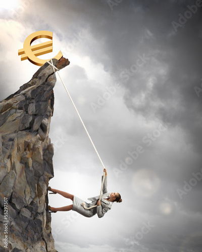 Photo: businesswoman climbing mountain businesswoman climbing mountain