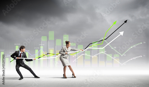Photo: Businesspeople pulling graph Businesspeople pulling graph
