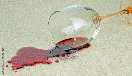 Photo: A spilled glass of red wine on a carpet A spilled glass of red wine on a carpet