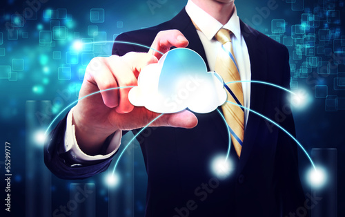 Photo: Business man with blue cloud computing concept Business man with blue cloud computing concept