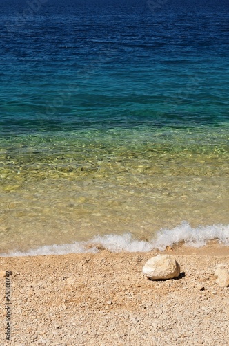 Photo: Beautiful beach with big stone in right bottom side of photo Beautiful beach with big stone in right bottom side of photo