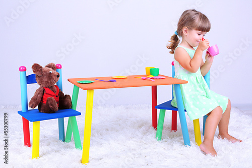 Photo: Little cute girl sitting Little cute girl sitting