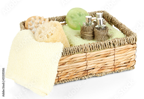 Photo: Set for spa in wicker basket, isolated on white Set for spa in wicker basket, isolated on white