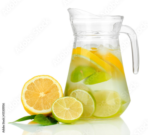 Photo: Cold water with lime, lemon and ice in pitcher isolated on Cold water with lime, lemon and ice in pitcher isolated on
