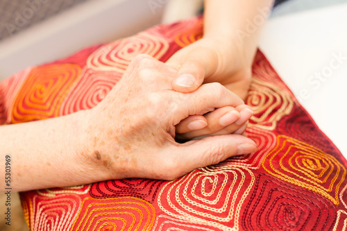 Photo: Young hands caring for old hands Young hands caring for old hands
