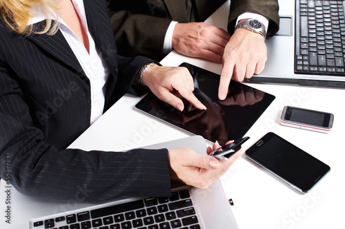 Photo: Business people group working with laptop. Business people group working with laptop.