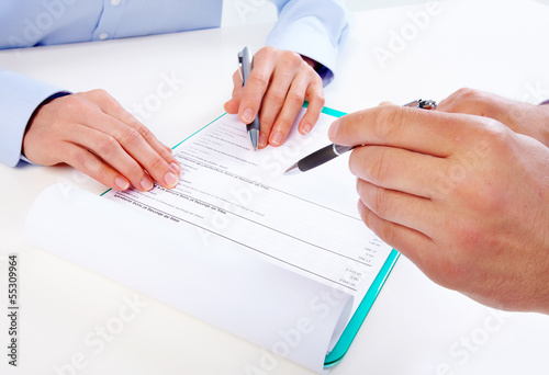 Photo: Writing business people. Writing business people.