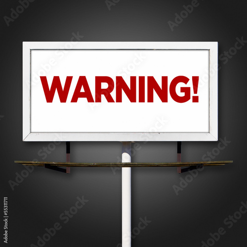 Photo: Warning Billboard Sign on Dark Background Warning Billboard Sign on Dark Background