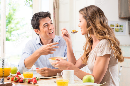 Photo: Couple Enjoying Breakfast Couple Enjoying Breakfast