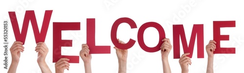 Photo: Persons Holding Welcome Persons Holding Welcome
