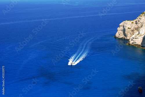 Photo: motorboat and cliff, Zakynthos island, Greece motorboat and cliff, Zakynthos island, Greece