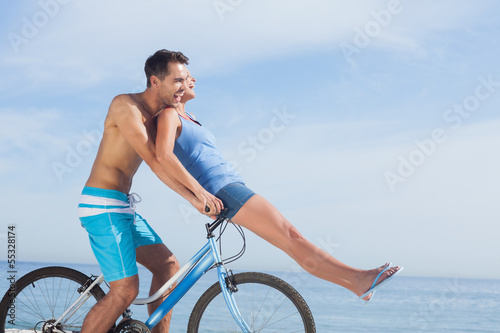 Photo: Man giving girlfriend a lift on his crossbar Man giving girlfriend a lift on his crossbar