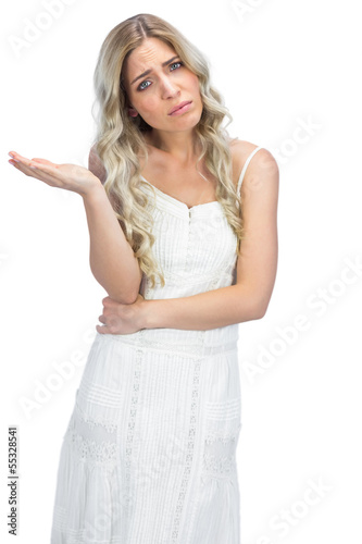Photo: Anxious blonde having interrogative posture Anxious blonde having interrogative posture