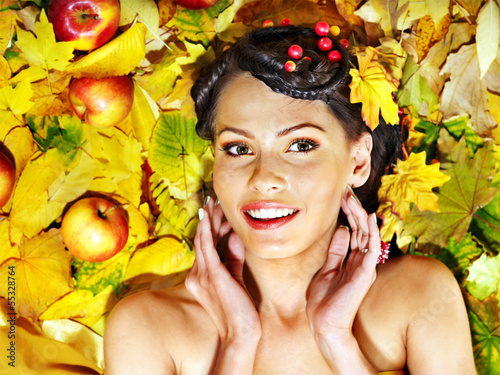 Photo: Woman holding autumn fruit. Woman holding autumn fruit.