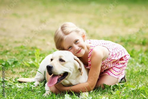 Photo: little girl with her dog little girl with her dog