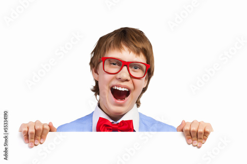 Photo: Boy in red glasses holding white square Boy in red glasses holding white square