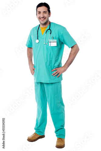 Photo: Young male physician posing casually Young male physician posing casually