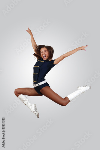Photo: Young female dancer against white background Young female dancer against white background