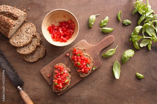 Photo: Bruschetta on wooden table Bruschetta on wooden table