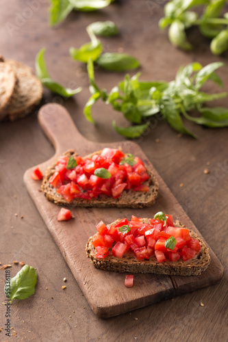 Photo: Italian bruschetta on wooden table Italian bruschetta on wooden table