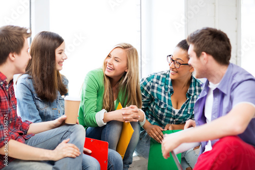 Photo: students communicating and laughing at school students communicating and laughing at school