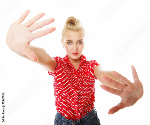 Photo: Young woman making stop gesture sign Young woman making stop gesture sign