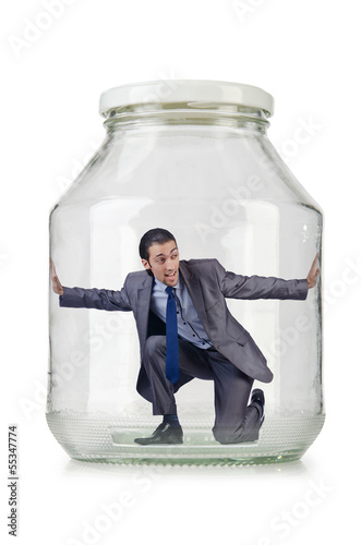 Photo: Young businessman in glass jar Young businessman in glass jar