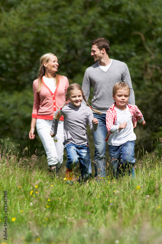 Photo: Family On Walk In Countryside Family On Walk In Countryside