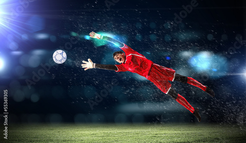 Photo: Goalkeeper catches the ball Goalkeeper catches the ball