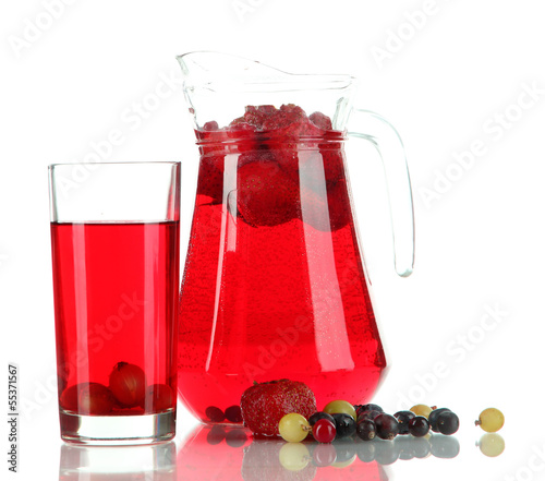 Photo: Pitcher and glass of compote isolated on white Pitcher and glass of compote isolated on white