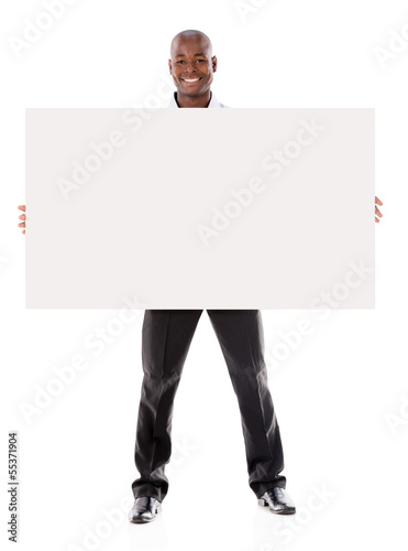 Photo: Business man holding a banner ad Business man holding a banner ad