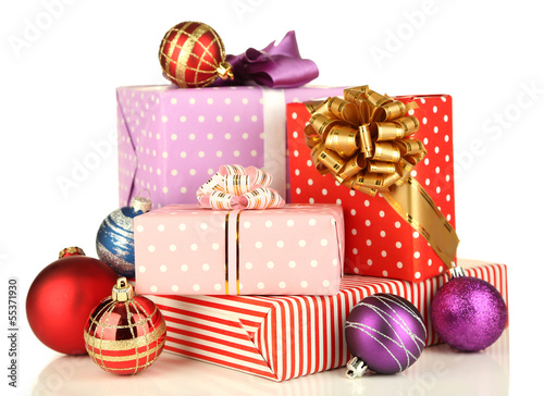 Photo: Gifts with christmas decorations, isolated on white Gifts with christmas decorations, isolated on white