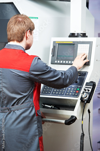 Photo: laborer worker with machining tool center laborer worker with machining tool center