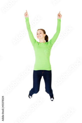 Photo: Young happy caucasian woman jumping in the air Young happy caucasian woman jumping in the air