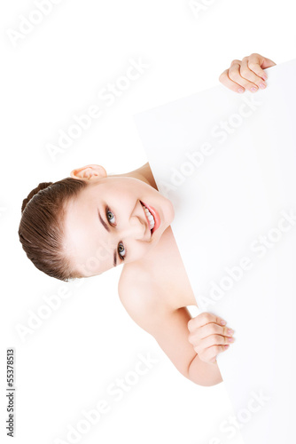 Photo: Beautiful woman with perfect skin and beautyful face holding bla Beautiful woman with perfect skin and beautyful face holding bla