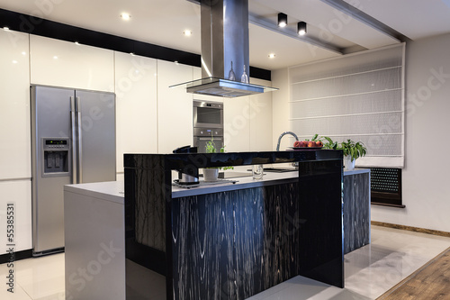 Photo: Urban apartment - Contemporary kitchen Urban apartment - Contemporary kitchen