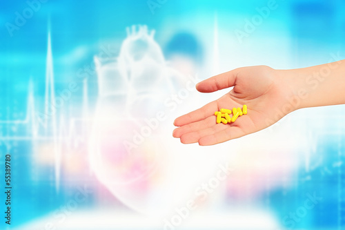 Photo: Human palm with pills Human palm with pills
