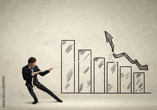 Photo: Businessman pulling graph Businessman pulling graph