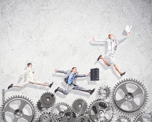 Photo: Business people and mechanism elements Business people and mechanism elements