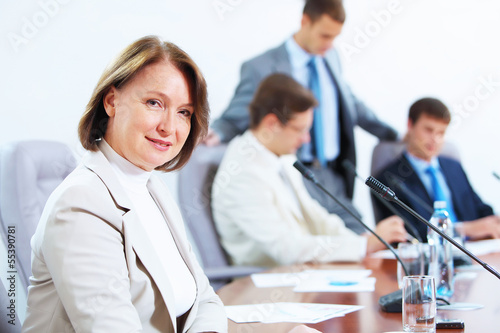 Photo: Four businesspeople at meeting Four businesspeople at meeting