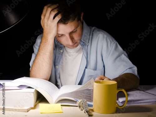 Photo: Young Man Studying at Night Young Man Studying at Night