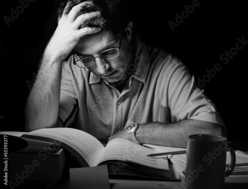 Photo: Young Man Studying at Night Young Man Studying at Night