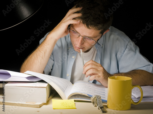 Photo: Young Man Studying at Night Young Man Studying at Night