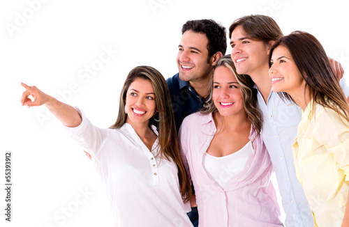 Photo: Group of friends pointing away Group of friends pointing away