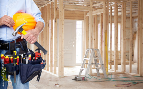 Photo: Handyman with a tool belt. Handyman with a tool belt.