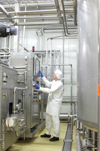 Photo: Technician controlling industrial process Technician controlling industrial process