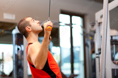 Photo: Man working out at the gym Man working out at the gym