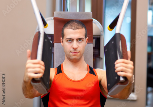 Photo: Man working out at the gym Man working out at the gym