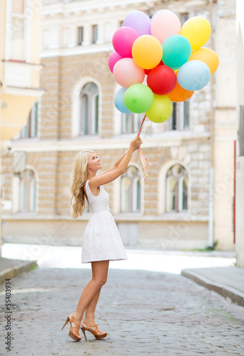 Photo: woman with colorful balloons woman with colorful balloons